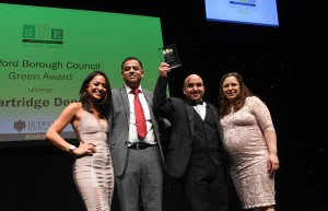 Vincenza & Guy (right) receiving the award from the sponsor of the award Mohammad Yasin MP